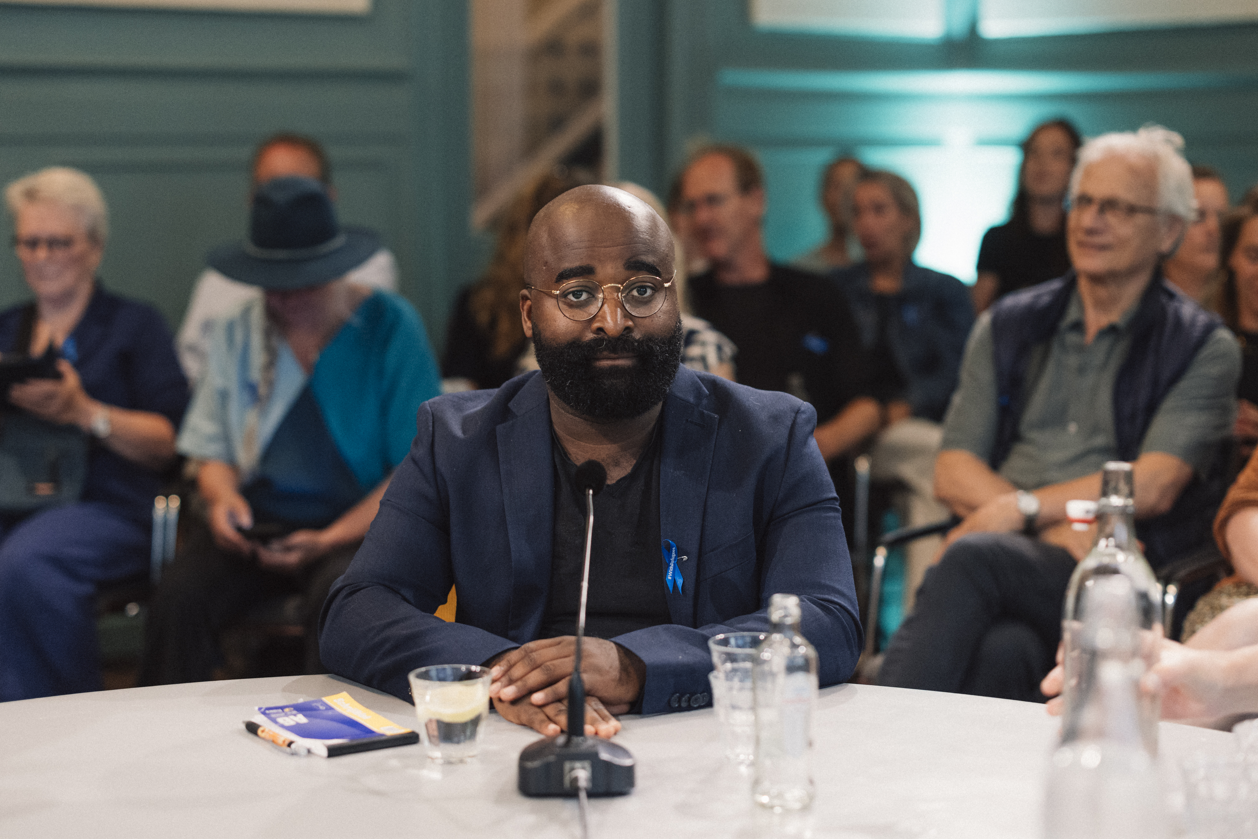 Kiza Magendane op het podium tijdens Springtij Forum
